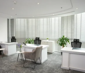 Contemporary office with large windows and modern furniture in Riyadh.