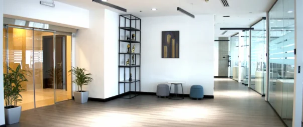 Spacious, well-lit office lobby with contemporary decor and seating area.