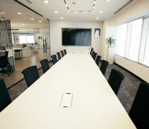 Spacious conference room with large windows and modern furnishings at WTC Riyadh.