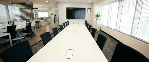 Spacious conference room with large windows and modern furnishings at WTC Riyadh.